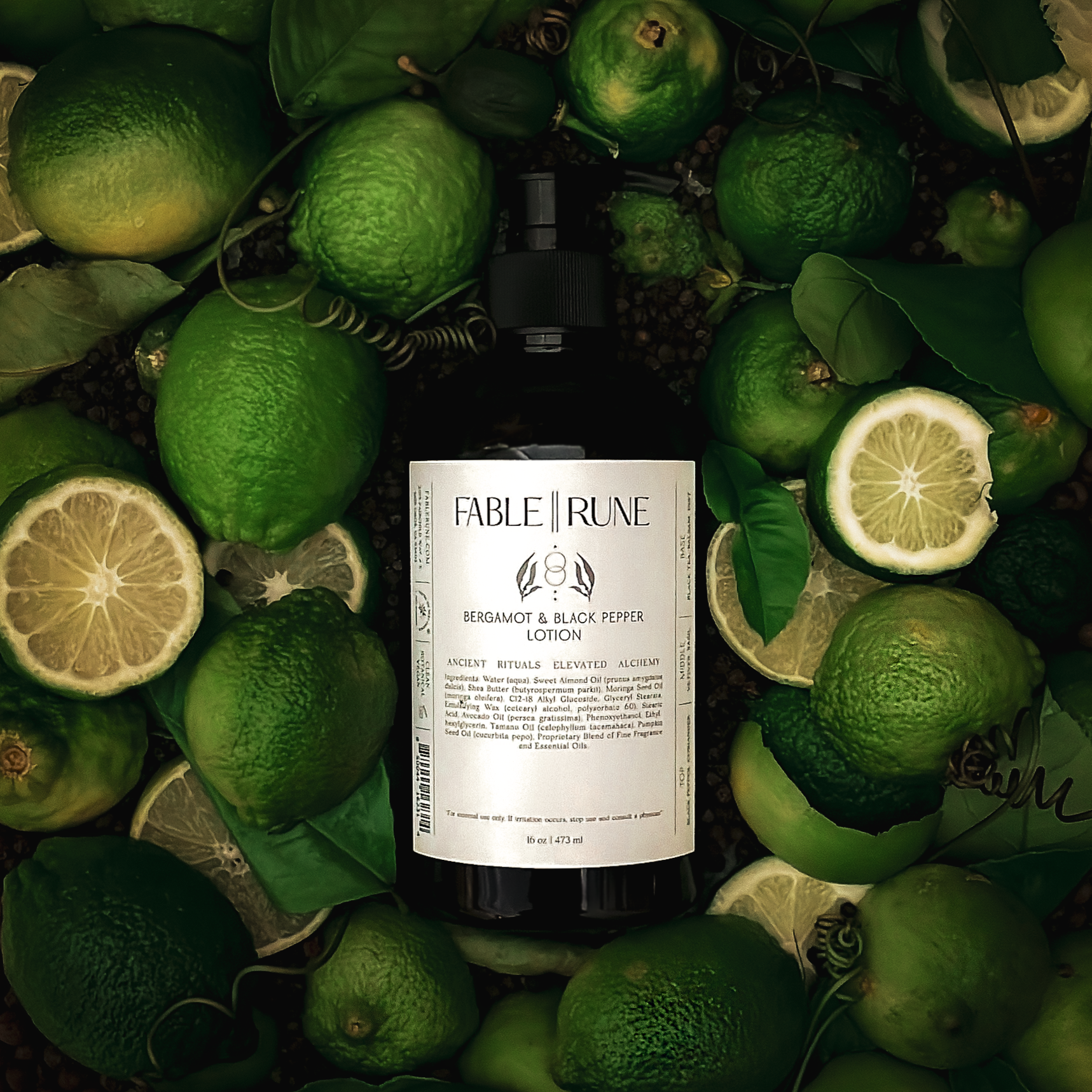 Bottle of Fable & Rune gin surrounded by bergamot citrus and leaves