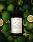 Bottle of Fable & Rune gin surrounded by bergamot citrus and leaves