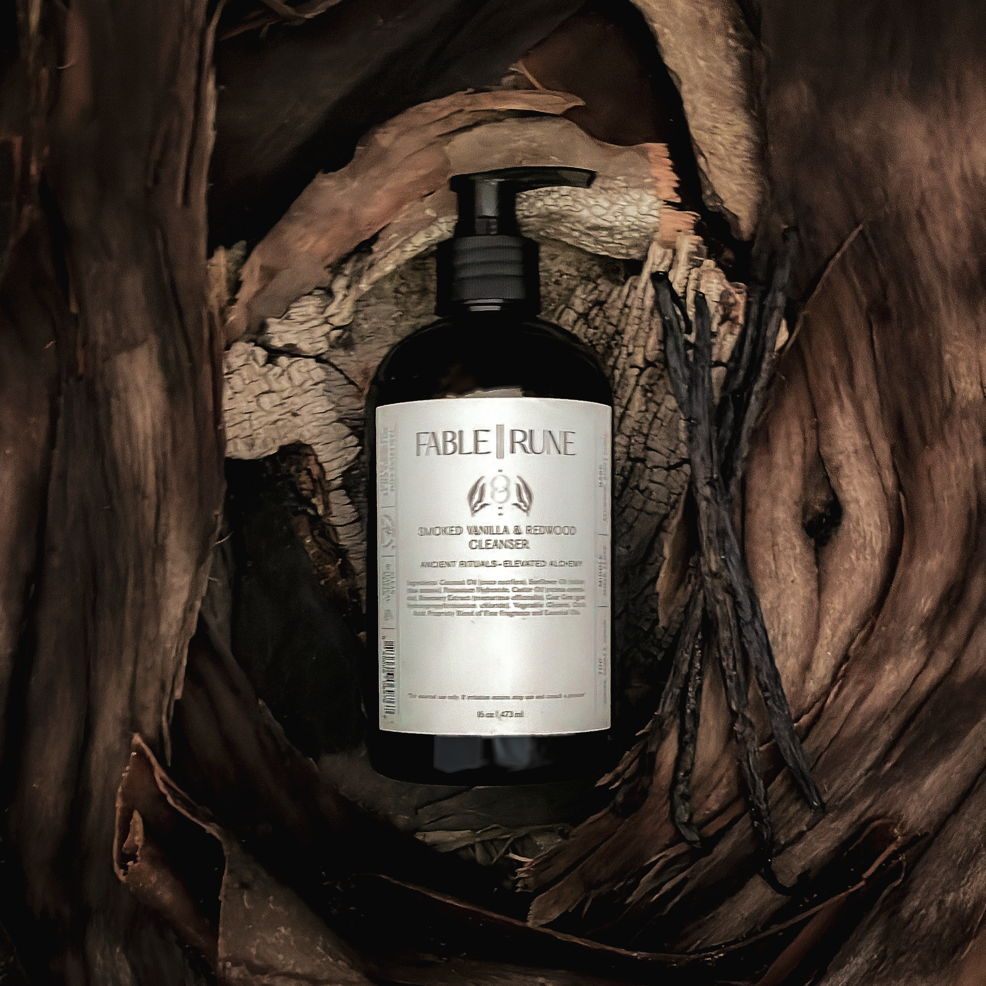 smoked vanilla redwood body cleanser in a natural wood setting