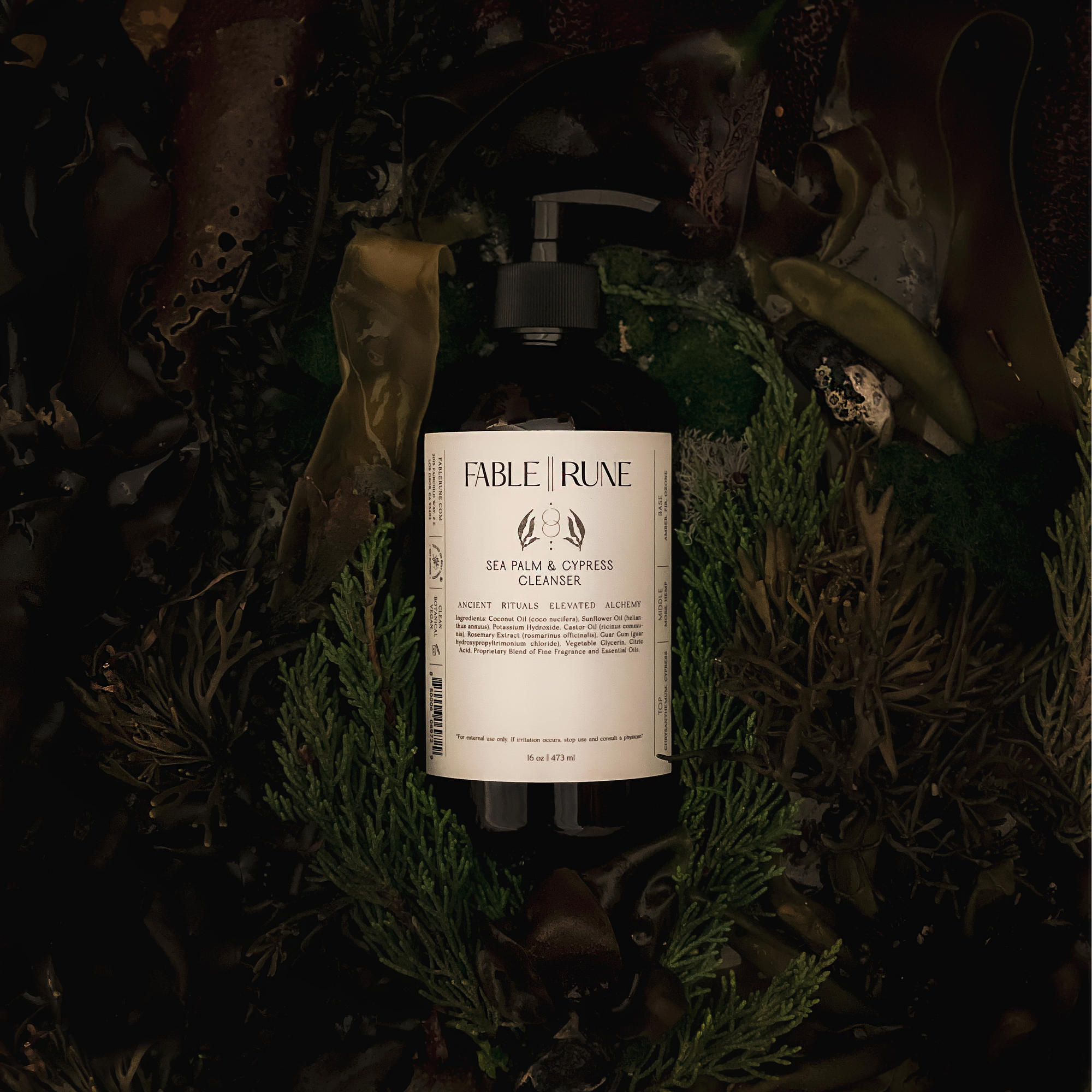 Sea palm cypress body cleanser surrounded by greenery