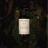 Sea palm cypress body cleanser surrounded by greenery